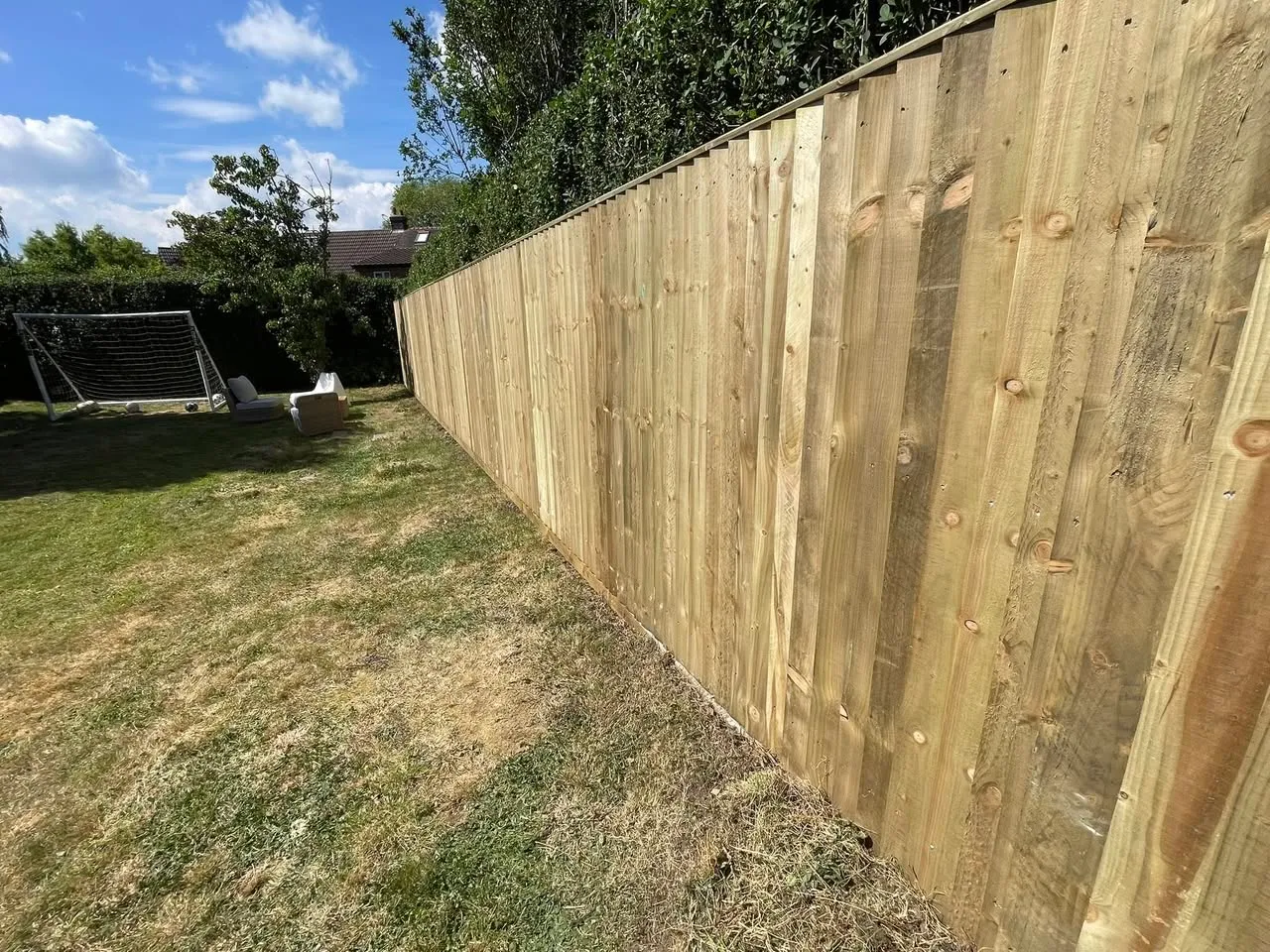 Close-board fencing in family garden
